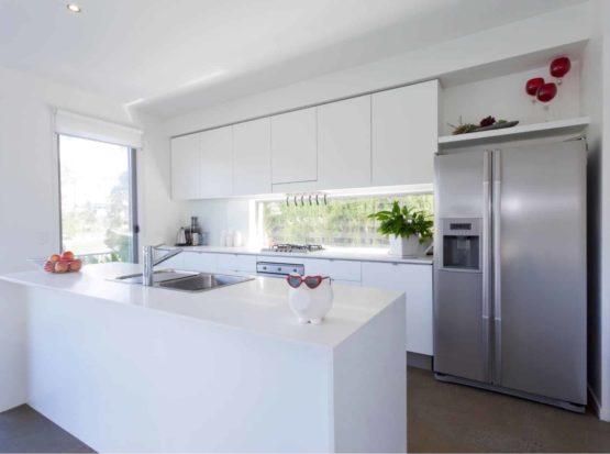 New Kitchen with silver appliances and white marble top in Chatswood